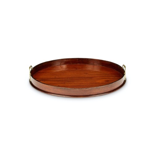 A George III mahogany oval tray With a high rim and pierced ...