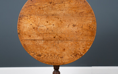 A George III oak circular tilt top tripod table