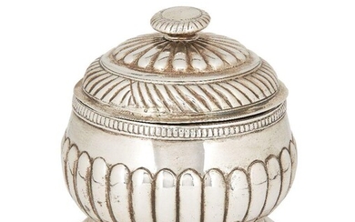 A George III silver sugar with cover, London, 1762, Thomas Whipham & Charles Wright, the lobed, rounded body raised on a circular foot, the domed and fluted pull off lid designed with flattened finial, 12cm high, approx. weight 11.1oz