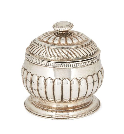 A George III silver sugar with cover, London, 1762, Thomas Whipham & Charles Wright, the lobed, rounded body raised on a circular foot, the domed and fluted pull off lid designed with flattened finial, 12cm high, approx. weight 11.1oz