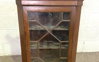 A George III style oak corner wall cabinet, with glazed door, dentil cornice and three shelves