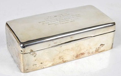 A George V hallmarked silver cigarette box of rounded rectangular...