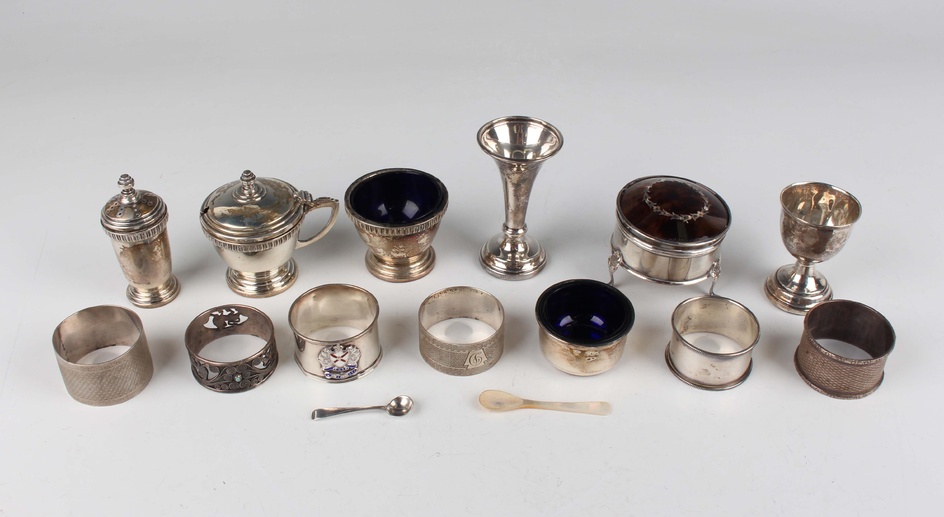 A George VI silver three-piece condiment set of tapered circular form with cast rims, comprising sal