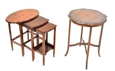 A Georgian-style mahogany oval topped nest of three tables, on...