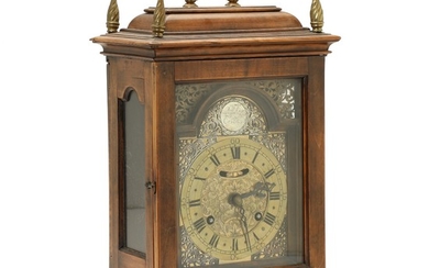 A German walnut table clock, plaque marked 'Johann Adam Erich'. Second half of the 18th century. H. 36 cm. W. 27 cm. D. 17 cm.