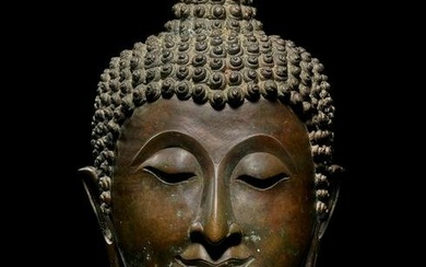 A LARGE COPPER ALLOY HEAD OF BUDDHA NORTHERN THAILAND, LAN NA KINGDOM, 15TH CENTURY