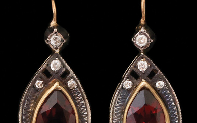 A PAIR OF 14K GOLD AND SILVER EARRINGS