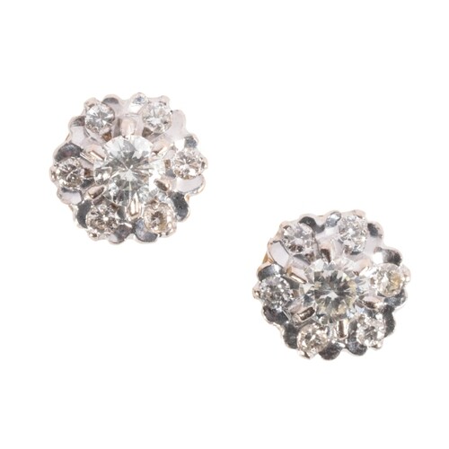 A PAIR OF DIAMOND CLUSTER EARRINGS the central brilliant-cut...