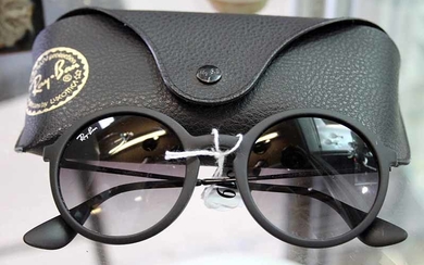 A PAIR OF RAYBAN SUNGLASSES