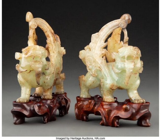 A Pair of Chinese Carved Jade Lions with Fitted