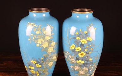 A Pair of Large Late Meiji Period Japanese Cloisonne Vases. The baluster bodies decorated with flowi