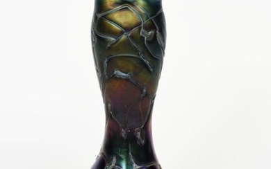 A Palme Koenig iridescent glass vase, compressed ovoid body with tall swollen neck, cast in low relief and applied with sinuous foliate design, iridescent ground unsigned, 33cm. high