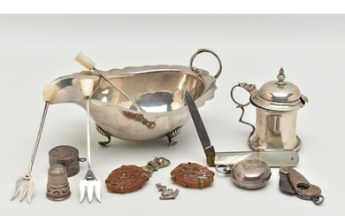 A SELECTION OF SILVER ITEMS, to include a gravy boat, with w...