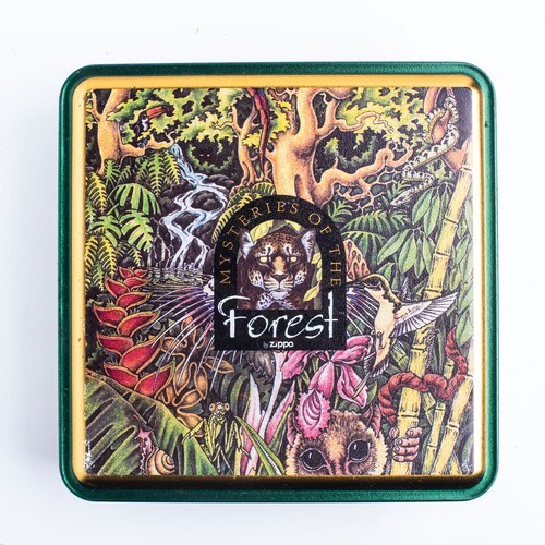 A SET OF FOUR CASED MYSTERY OF THE FORREST ZIPPO LIGHTERS