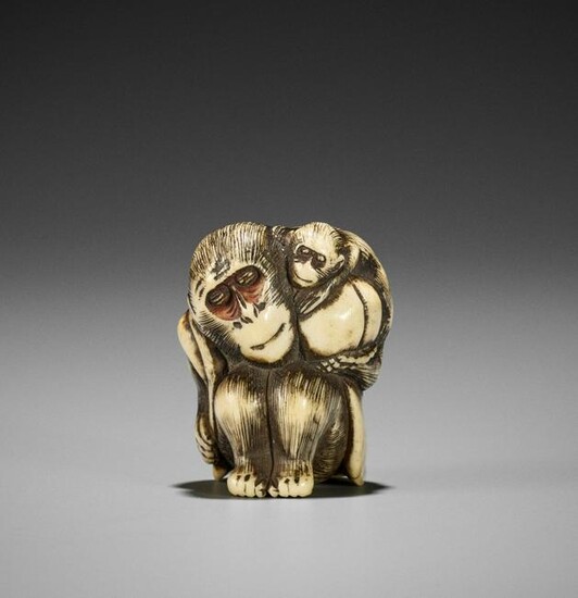 A STAG ANTLER NETSUKE OF A MONKEY