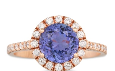 A TANZANITE AND DIAMOND CLUSTER RING, the circular stones to...