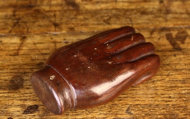 A Treen Snuff Box carved in the form of a hand with a hinged pewter lid to the palm, 3½'' (9 cm) in