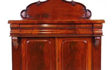 A Victorian mahogany chiffonier, the carved moulded back over a...