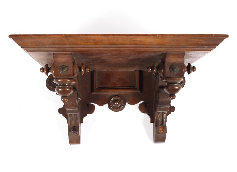 A Victorian mahogany clock wall bracket, with inverted turned baluster ornament and roundels