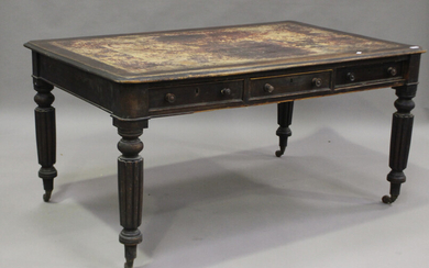A Victorian mahogany library table, the moulded top inset with a leather writing surface above oppos