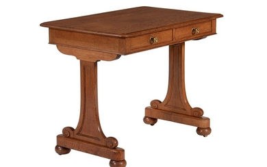 A Victorian oak side or writing table