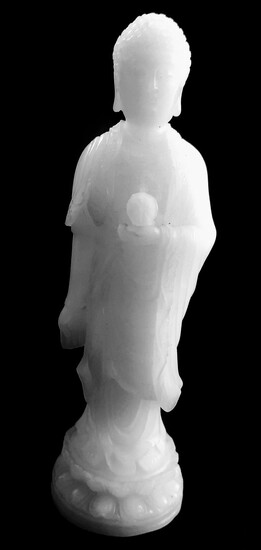 A WHITE JADE FIGURE OF A STANDING BUDDHA- Qing...