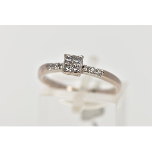 A WHITE METAL DIAMOND RING, designed with a square mount set...