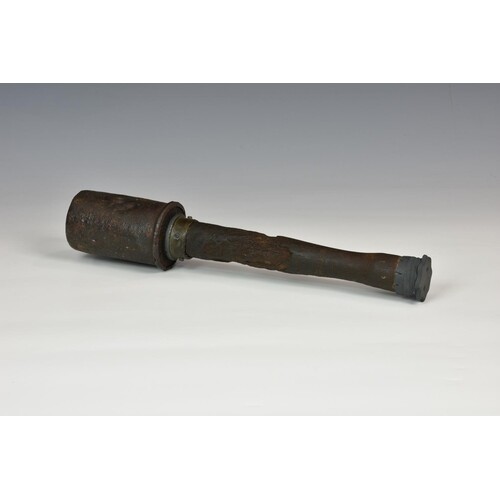 A WWI German stick grenade, of typical form in relic conditi...