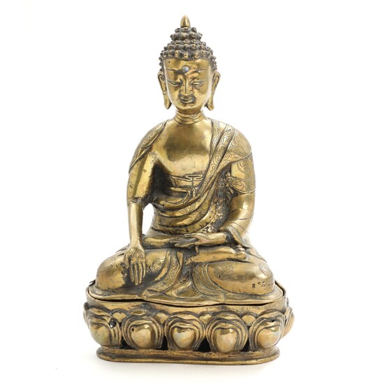 NOT SOLD. A bronze figure of Buddha with glass Urna, seated in at pierced lotus...