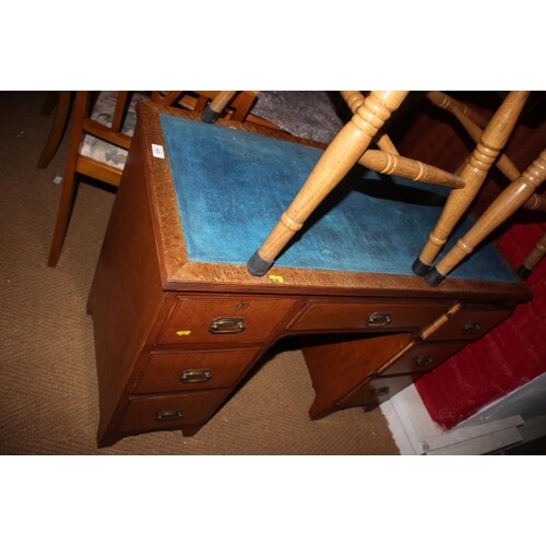 A burr maple double pedestal desk with blue tooled lined top...