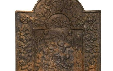 A cast iron fire back of broken arched design, 19th century