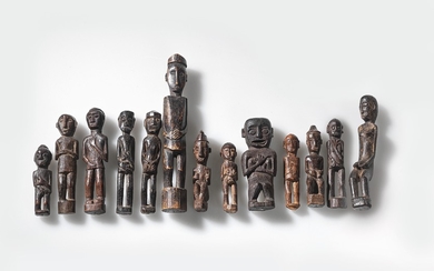 A collection of 13 small Dayak amulets.