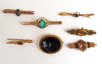 A collection of early 20th century yellow metal brooches marked...