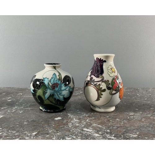 A collection of eight contemporary Moorcroft vases and bowls...