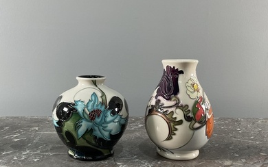 A collection of eight contemporary Moorcroft vases and bowls...