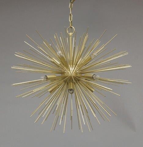 A contemporary brass starburst ceiling light, of recent manufacture, comprising different length brass rods emanating from a central domed brass case, 92cm high It is the buyer's responsibility to ensure that electrical items are professionally...