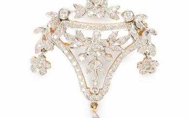 A diamond and fourteen karat gold brooch