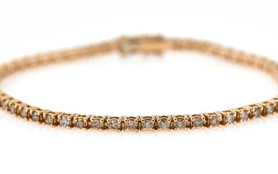 A diamond bracelet set with numerous brilliant-cut champagne-coloured diamonds weighing a total...