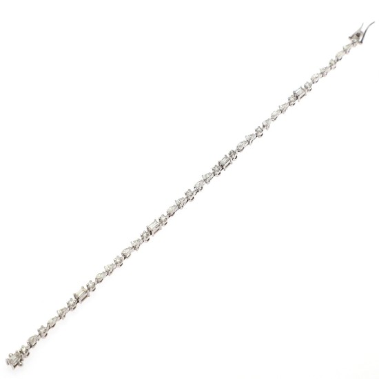 A diamond bracelet set with numerous brilliant, navette and baguette-cut and pear- shaped diamonds totalling app. 2.85 ct., mounted in 14k white gold.