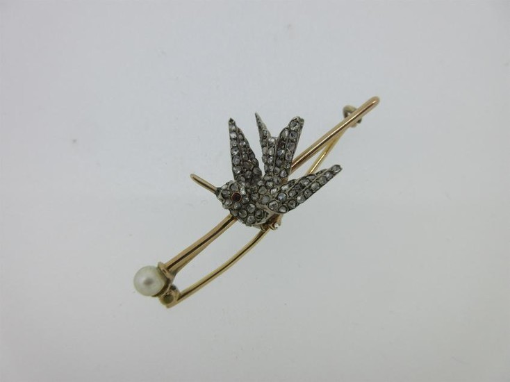 A diamond set hummingbird brooch