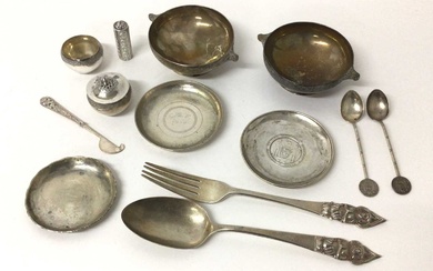 A group of Eastern silver and white metal, including a pair of engraved Indian bowls, a salt and pepper, snuff bottle, knife, dish with inset 'Tientsin British Municipal Emergency Corps' medallion,...