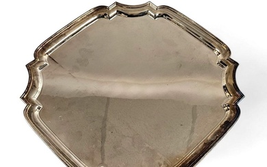 A hallmarked silver canted square salver with stepped border...