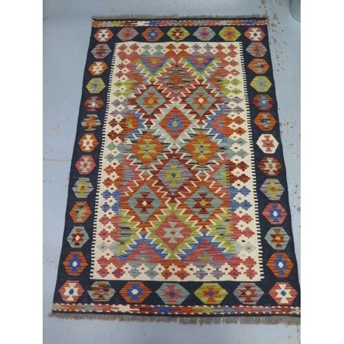 A hand knotted woollen Chobi Kilim rug, 156cm x 100cm