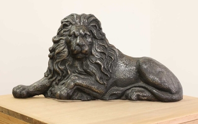 A large cast iron recumbent lion