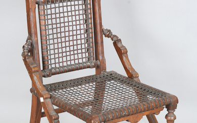 A late 19th century American Arts and Crafts walnut framed side chair by George Hunzinger, the seat