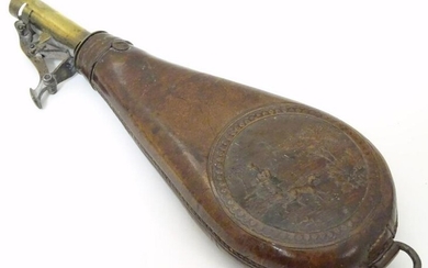 A late 19thC leather and brass shot flask, decorated