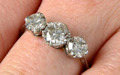 A mid 20th century platinum, graduated diamond three stone ring.
