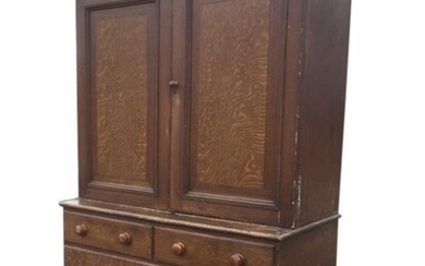 A nineteenth century scumbled pine press cupboard with moulded...