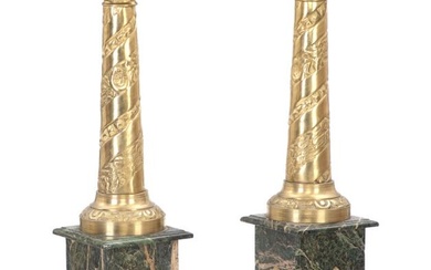 A pair of Empire style brass and green marble pedestals. 20th century....