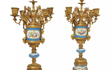 A pair of French gilt-bronze mounted Sèvres-style porcelain five-light candelabra,...